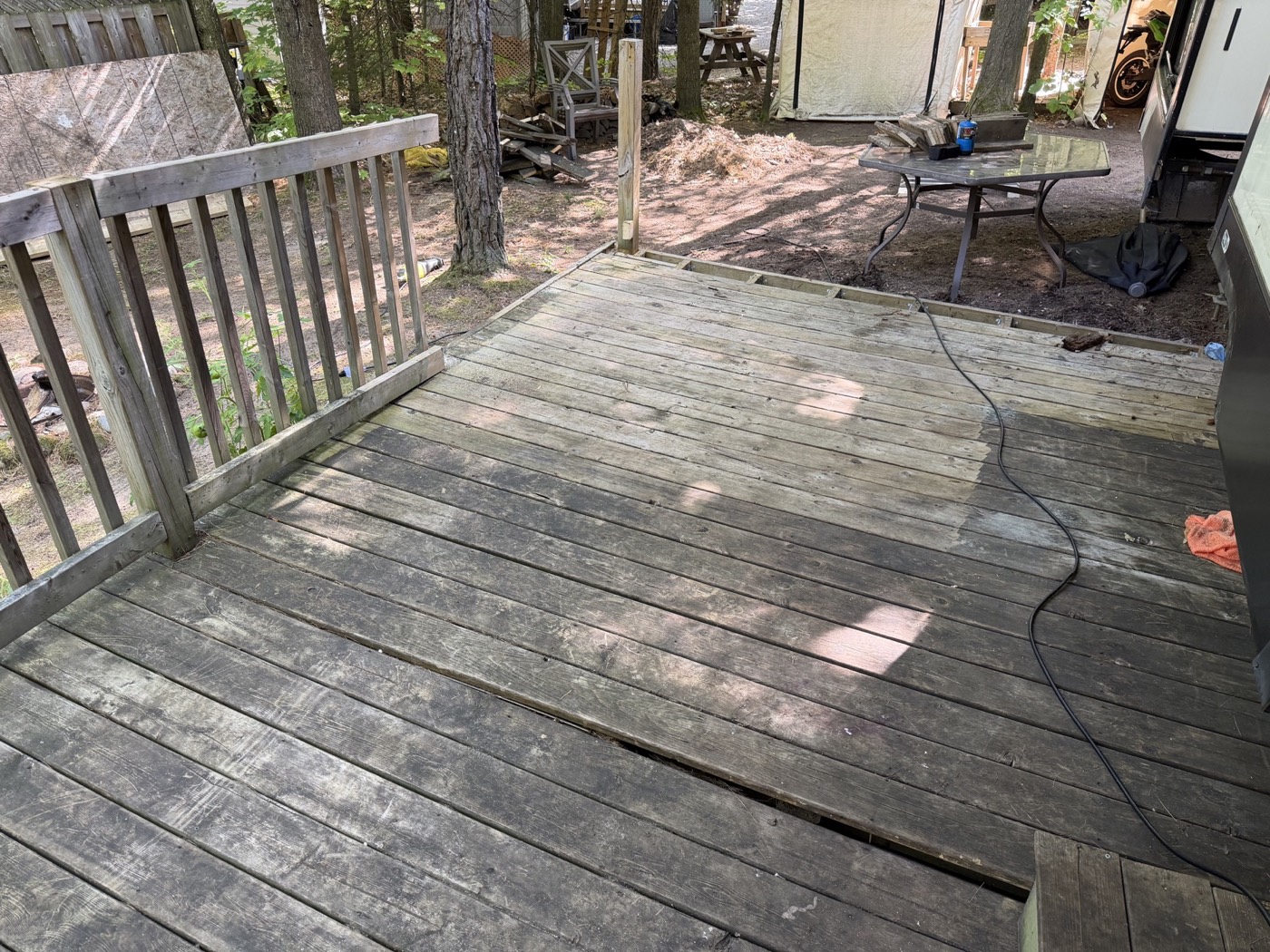 A weathered wooden deck before demolition