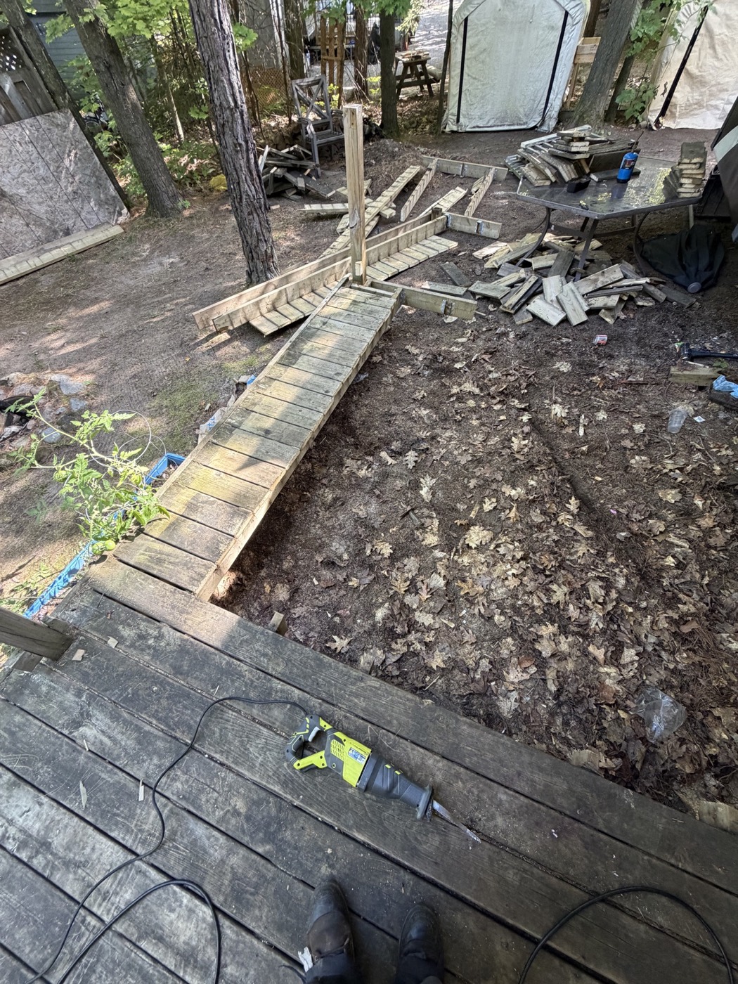 Wooden deck partially dismantled during demolition
