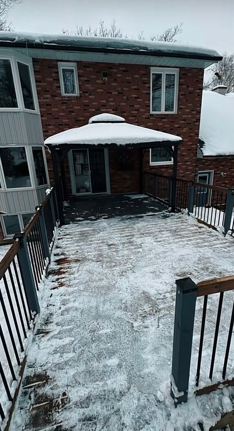 Residential deck cleared of snow